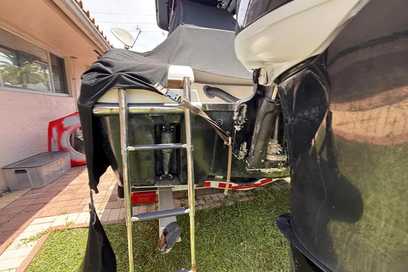 Slide: The Image of Rear view of a 2015 Blackwood 27 boat with ladder and cover. - 10