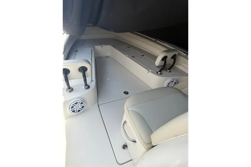 Slide: The Image of Interior of a 2015 Blackwood 27 boat featuring seating and speakers. - 21