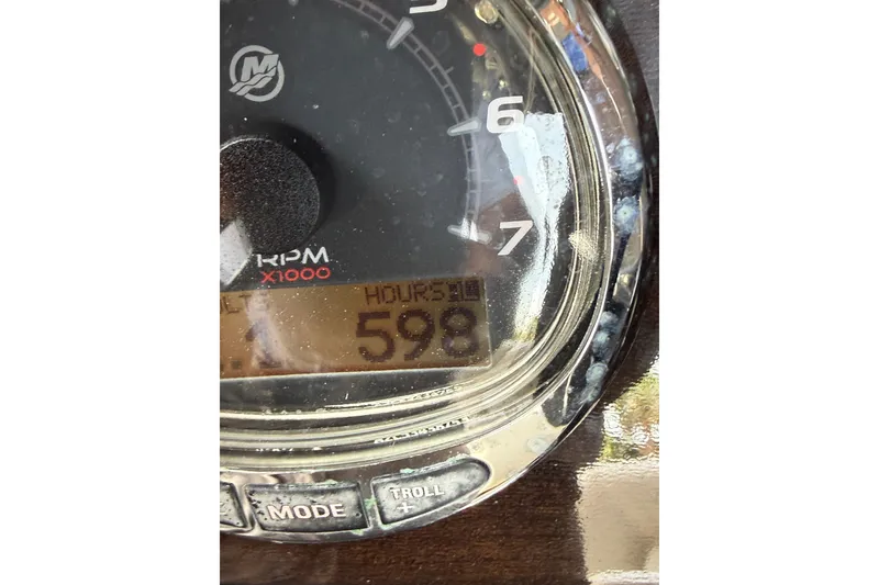 Slide: The Image of Close-up of Blackwood 27 tachometer showing 598 hours, RPM gauge visible. - 29