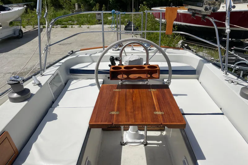 Slide: The Image of Cockpit of 1981 Hinterhoeller Niagara 35 sailboat with wooden table and steering wheel. - 12