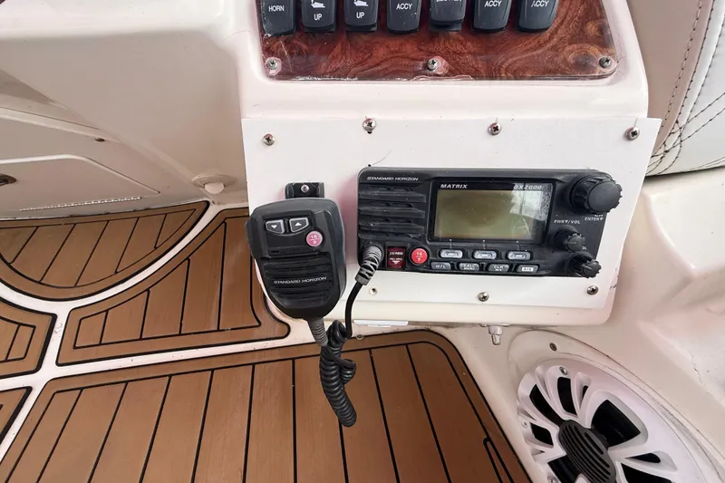 Slide: The Image of White cushioned seating on 2007 Meridian 459 Motoryacht with teak flooring. - 10