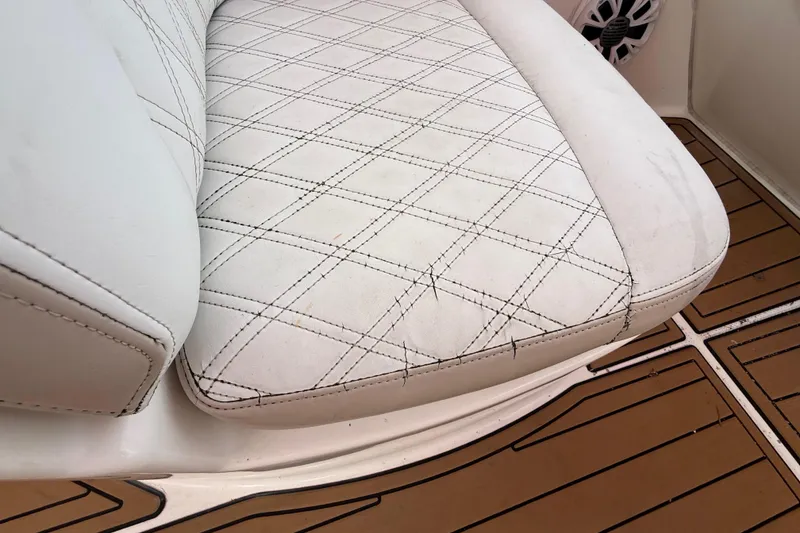 Slide: The Image of 2007 Meridian 459 Motoryacht interior with seating, storage, and cup holders. - 15