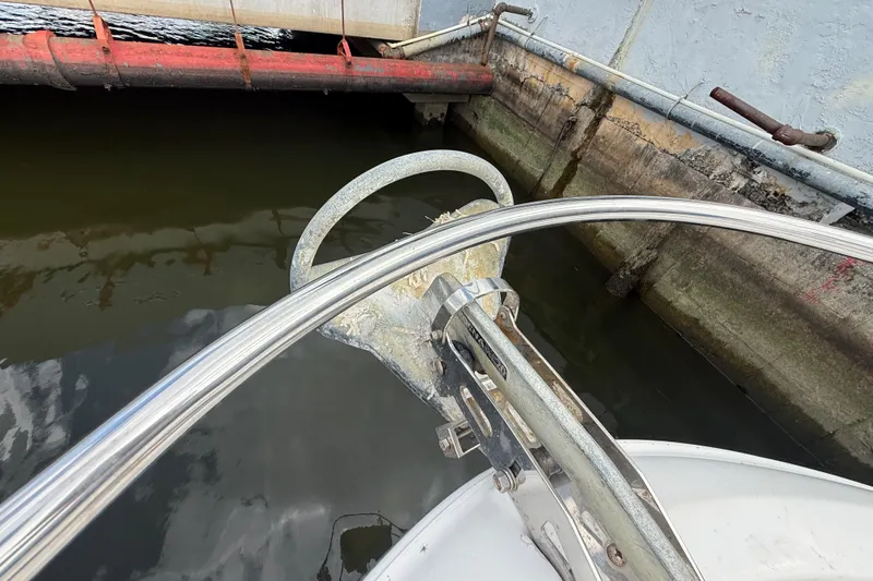 Slide: The Image of 2007 Meridian 459 Motoryacht docked beside a concrete pier with blue and red pipes. - 29