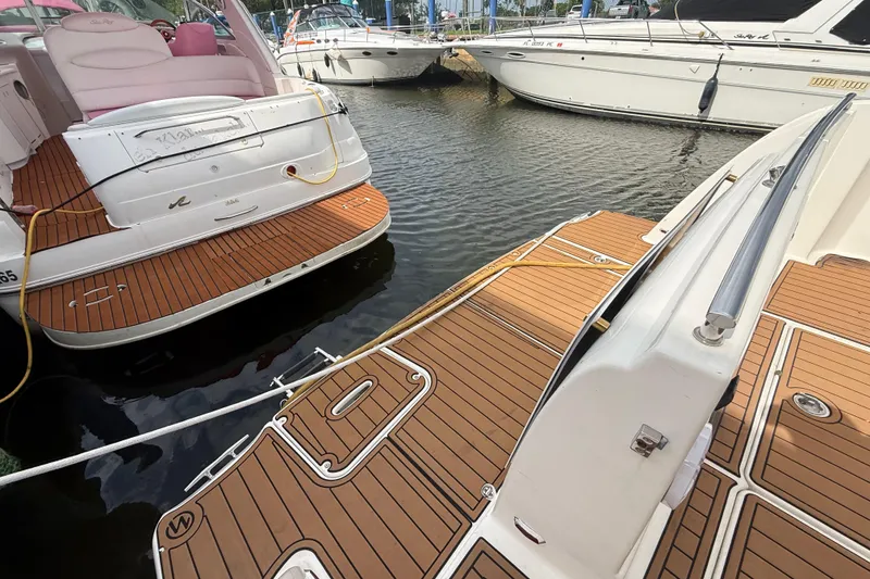 Slide: The Image of 2007 Meridian 459 Motoryacht deck with wooden flooring and sliding glass doors. - 44