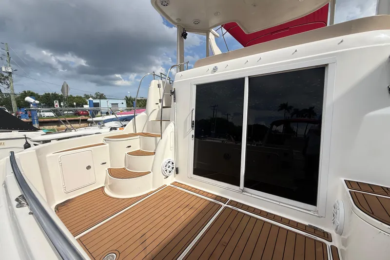 Slide: The Image of Damaged deck area on 2007 Meridian 459 Motoryacht with peeling wood panel. - 45