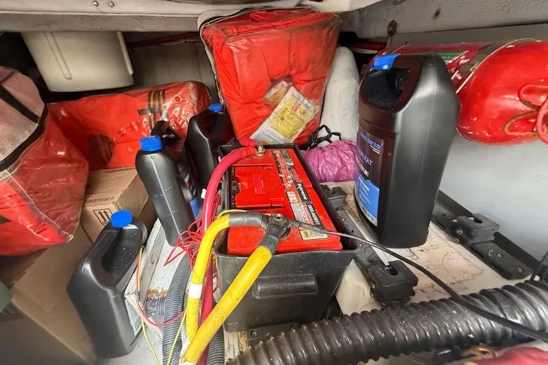 Slide: The Image of Engine room of 2007 Meridian 459 Motoryacht with battery, cables, and maintenance supplies. - 52