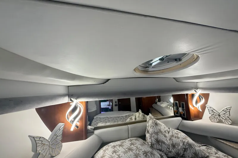 Slide: The Image of Luxurious interior of 2007 Meridian 459 Motoryacht with elegant decor and cozy bedding. - 60