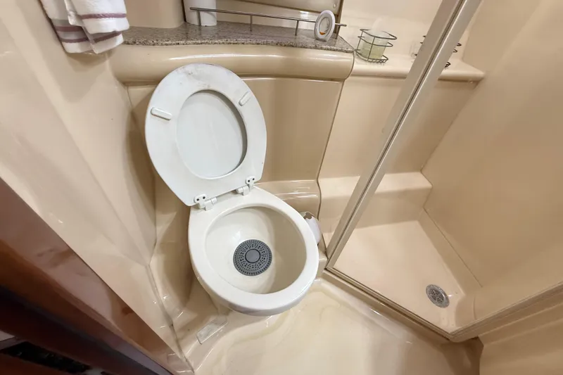 Slide: The Image of Bathroom sink area in 2007 Meridian 459 Motoryacht with granite countertop and stainless steel fixtures. - 63