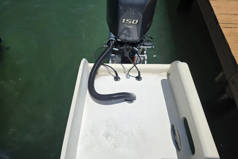 Slide: The Image of Twin Yamaha outboard motors on a 2014 Custom Exuma Catamaran 32 in water. - 12