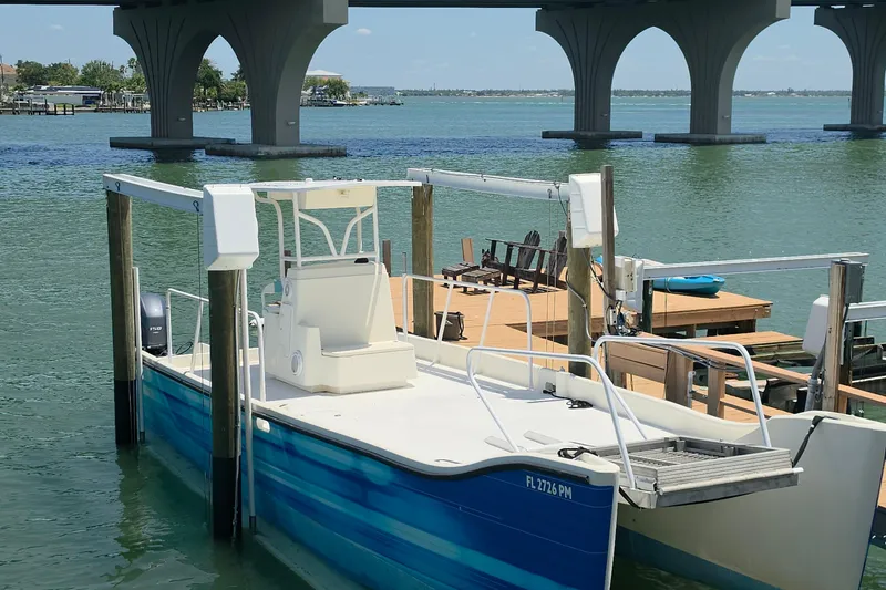 Slide: The Image of 2014 Custom Exuma Catamaran 32 docked under a bridge on a sunny day. - 4