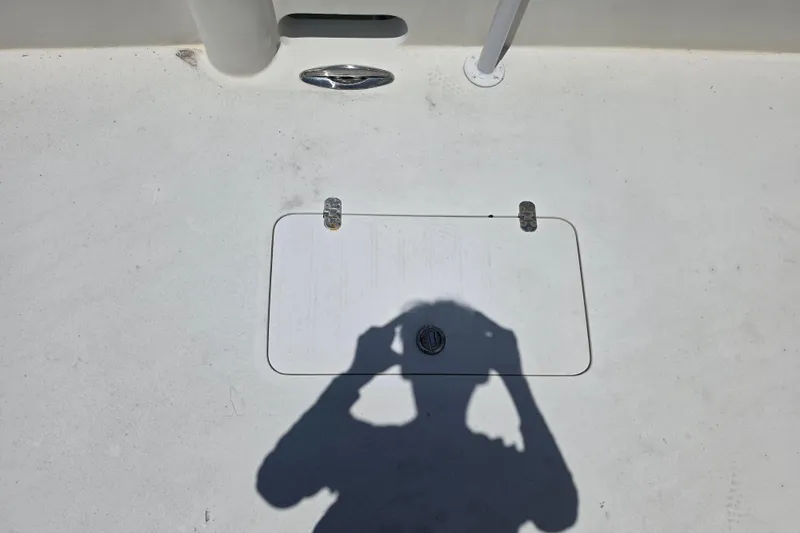 Slide: The Image of 2014 Custom Exuma Catamaran 32 with metal grate platform, docked by wooden pier. - 40
