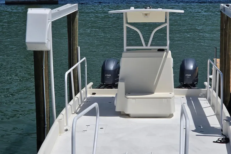Slide: The Image of 2014 Custom Exuma Catamaran 32 docked, featuring dual 150 horsepower engines. - 41
