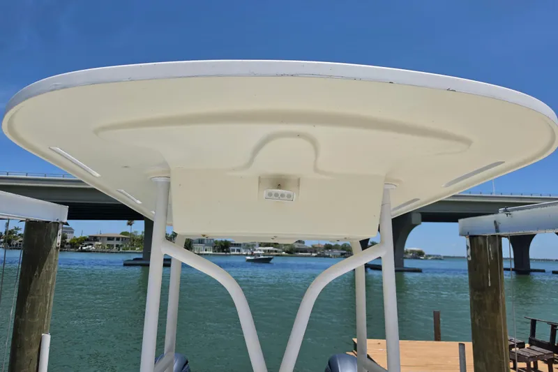 Slide: The Image of 2014 Custom Exuma Catamaran 32 docked near a bridge on a sunny day. - 42