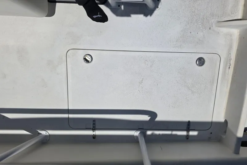 Slide: The Image of 2014 Custom Exuma Catamaran 32 docked, showcasing spacious deck and seating area. - 43