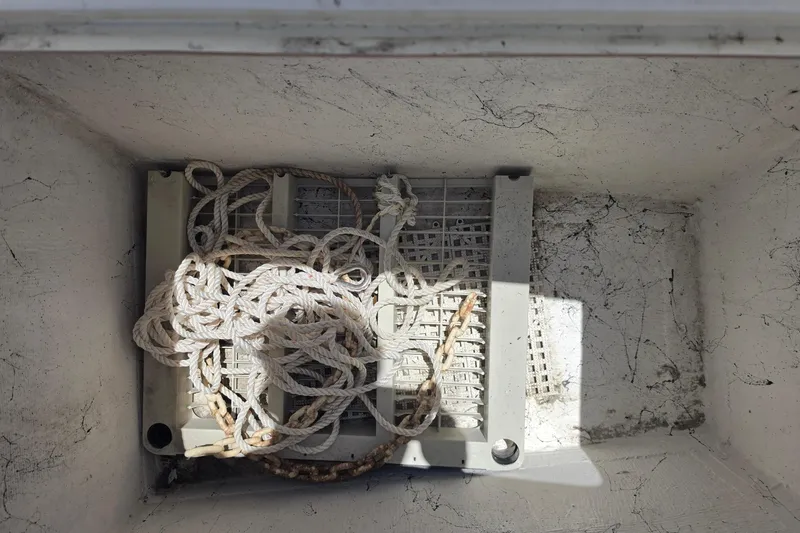 Slide: The Image of Storage compartment with coiled rope on a 2014 Custom Exuma Catamaran 32. - 53