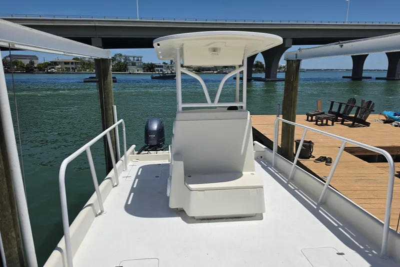 Slide: The Image of 2014 Custom Exuma Catamaran 32 deck with seating area and railing. - 55