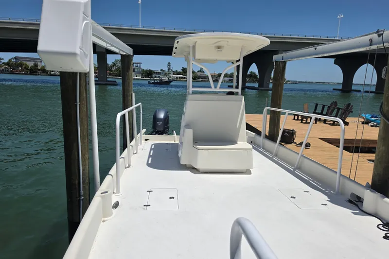 Slide: The Image of Open storage compartment on 2014 Custom Exuma Catamaran 32 with boating gear inside. - 56
