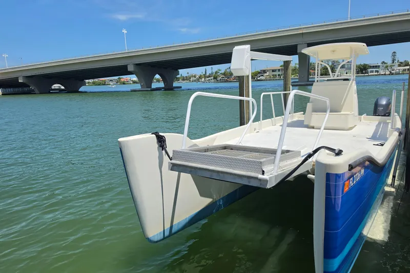 Slide: The Image of Storage compartment of 2014 Custom Exuma Catamaran 32 with paddle and bottle. - 67