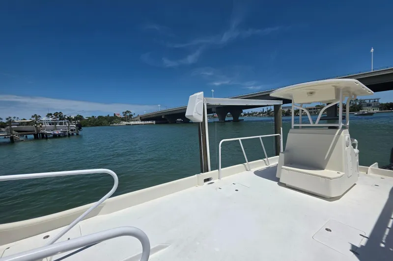 Slide: The Image of Outboard motor on 2014 Custom Exuma Catamaran 32 in green water. - 74