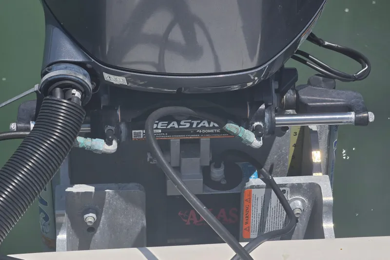 Slide: The Image of 2014 Custom Exuma Catamaran 32 with twin Yamaha 150 engines docked in clear water. - 8