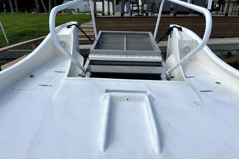 Slide: The Image of 2014 Custom Exuma Catamaran 32 with metal boarding ramp and white deck. - 80