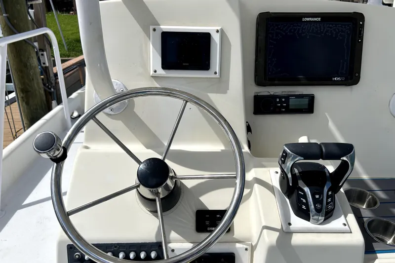 Slide: The Image of Helm of 2014 Custom Exuma Catamaran 32 with steering wheel and navigation equipment. - 86