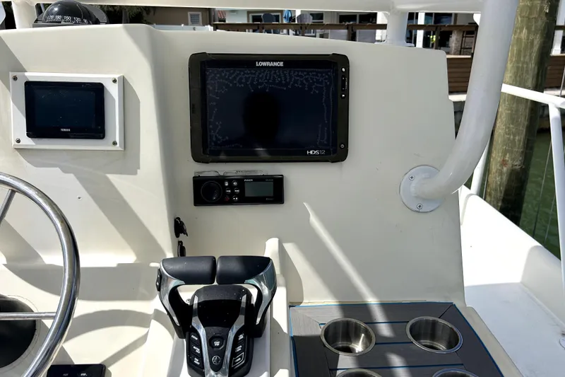 Slide: The Image of Control panel of 2014 Custom Exuma Catamaran 32 with navigation and throttle controls. - 87