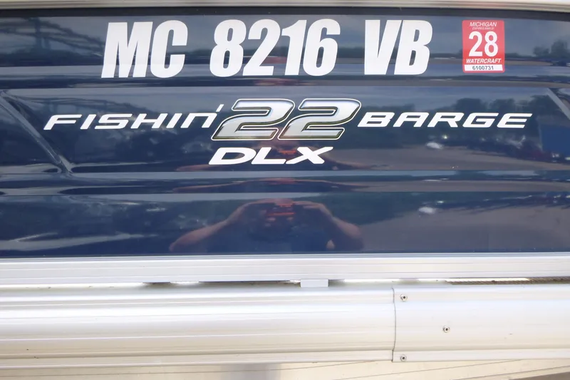 Slide: The Image of 2025 Sun Tracker Fishin' Barge 22 DLX with Michigan registration sticker. - 16