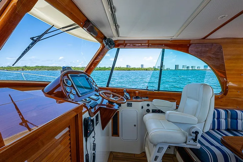 Slide: The Image of Interior view of 2015 Hinckley Picnic Boat 37 MKIII helm with ocean backdrop. - 16