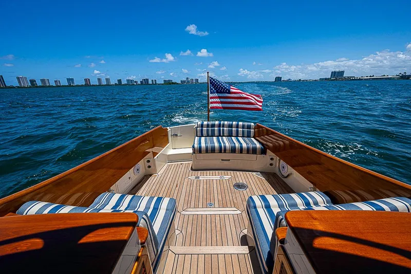 Slide: The Image of Hinckley Picnic Boat 37 MKIII cruising with American flag, 2015 model, ocean view. - 5