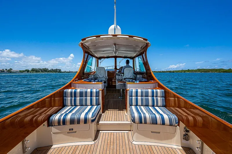 Slide: The Image of Hinckley Picnic Boat 37 MKIII, 2015 model, cruising on open water under clear blue skies. - 7
