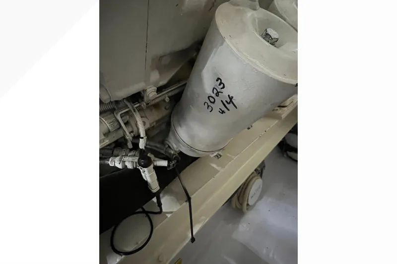 Slide: The Image of Engine compartment of 1999 Viking 60 CPMY with visible filter and wiring. - 135