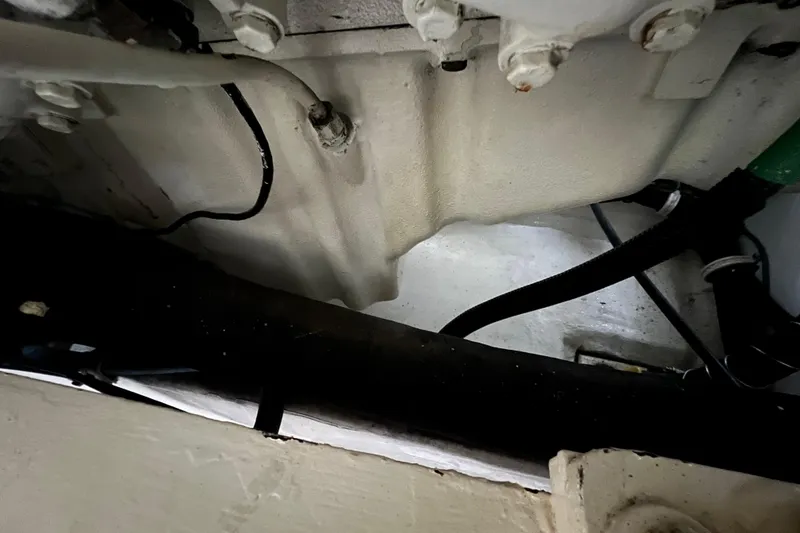 Slide: The Image of Engine compartment of a 1999 Viking 60 CPMY yacht, showing cables and components. - 136