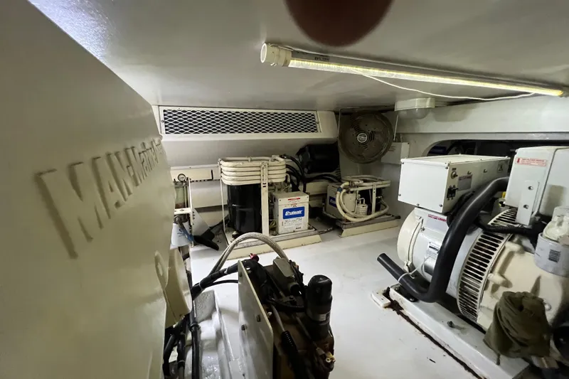 Slide: The Image of Engine room of 1999 Viking 60 CPMY yacht with mechanical equipment and ventilation. - 138