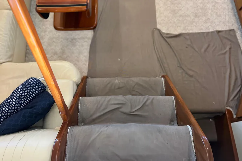 Slide: The Image of Interior stairs of a 1999 Viking 60 CPMY yacht with wooden handrails. - 61
