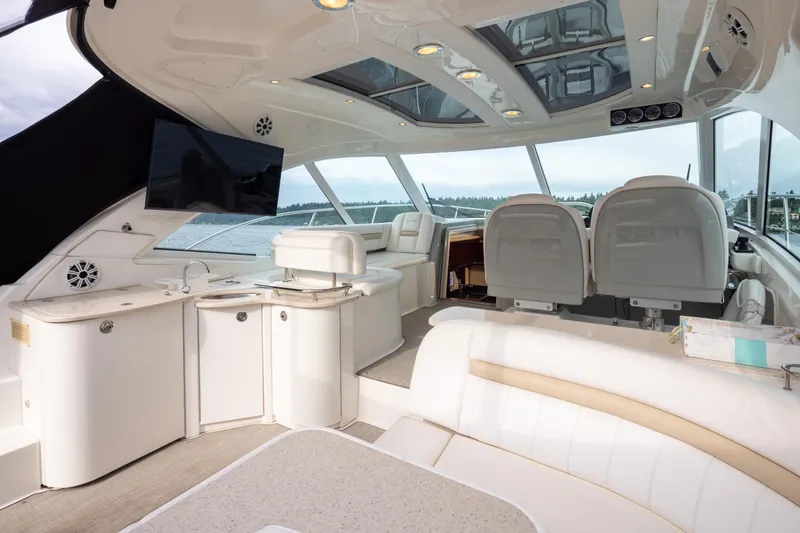 Slide: The Image of Luxurious interior of 2010 Sea Ray 500 Sundancer yacht with modern amenities and seating. - 10
