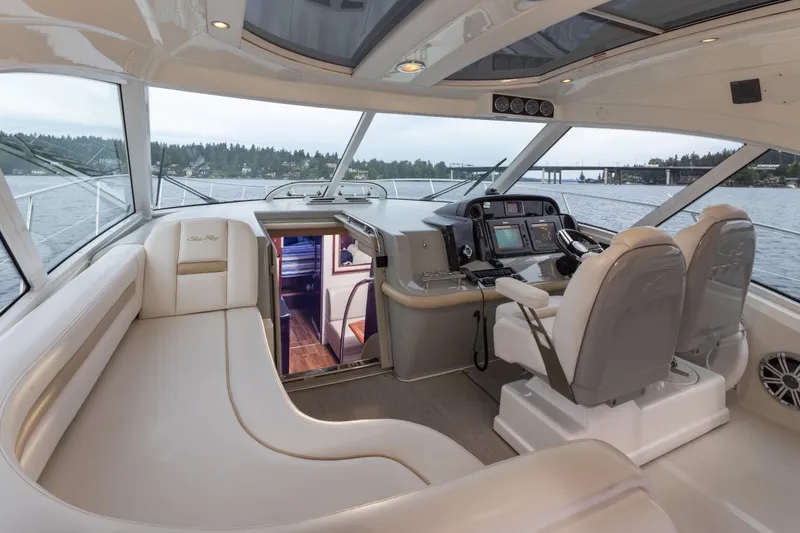 Slide: The Image of Luxurious interior of 2010 Sea Ray 500 Sundancer yacht with helm and seating area. - 12