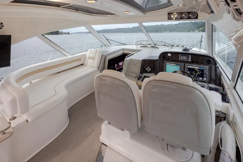 Slide: The Image of Luxurious interior of 2010 Sea Ray 500 Sundancer yacht with modern navigation equipment. - 13