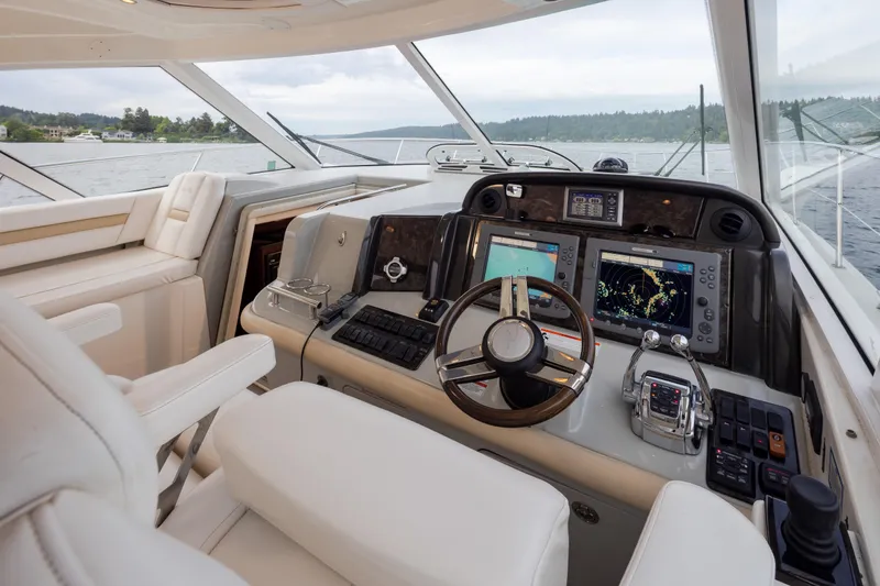 Slide: The Image of Helm of 2010 Sea Ray 500 Sundancer yacht with advanced navigation systems. - 14