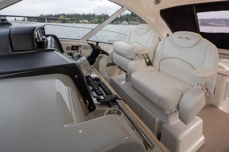 Slide: The Image of Luxurious 2010 Sea Ray 500 Sundancer yacht interior with plush white seating. - 15