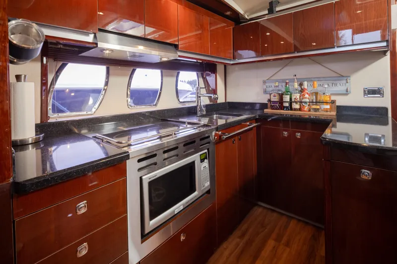 Slide: The Image of Luxurious kitchen interior of 2010 Sea Ray 500 Sundancer yacht with modern appliances. - 20