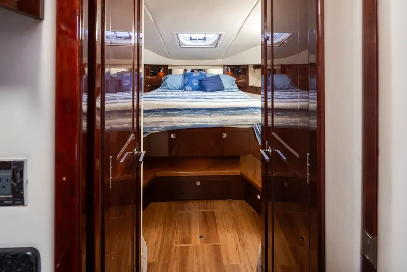 Slide: The Image of Luxurious cabin interior of 2010 Sea Ray 500 Sundancer yacht with cozy bedding. - 22