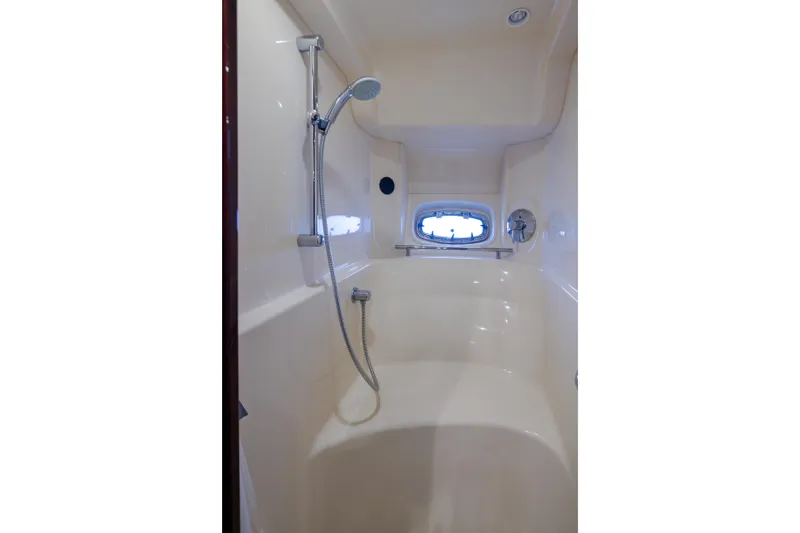 Slide: The Image of Shower area in 2010 Sea Ray 500 Sundancer yacht, featuring sleek design and modern fixtures. - 25
