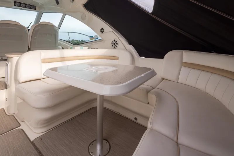 Slide: The Image of Luxurious interior of 2010 Sea Ray 500 Sundancer yacht with elegant seating and table. - 8