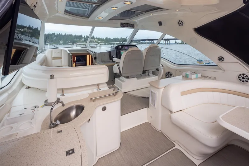 Slide: The Image of Luxurious interior of 2010 Sea Ray 500 Sundancer yacht with elegant seating and modern amenities. - 9