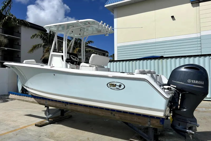 The Image of 2017 Sea Hunt Ultra 232 boat with Yamaha engine on display outdoors. - 1