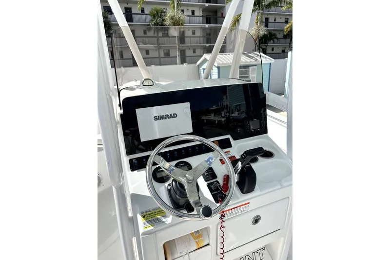 Slide: The Image of 2017 Sea Hunt Ultra 232 boat console with Simrad navigation system. - 5
