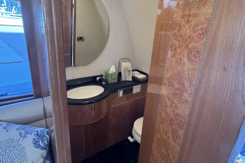 Slide: The Image of Luxurious bathroom interior of 2003 Altima 55 Pilothouse yacht with elegant wood finish. - 25