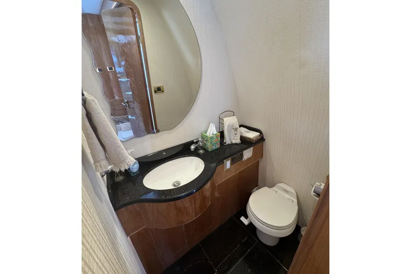 Slide: The Image of Luxurious bathroom in 2003 Altima 55 Pilothouse yacht with modern fixtures and elegant design. - 26