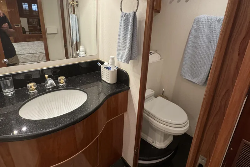 Slide: The Image of Luxurious bathroom in 2003 Altima 55 Pilothouse yacht with elegant sink and toilet. - 44